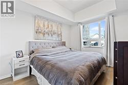 Bedroom with wood finished floors - 