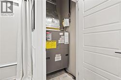 Utility room featuring heating unit - 