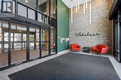 Community lobby featuring a towering ceiling and recessed lighting - 