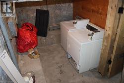 Laundry area with separate coin operated washer and dryer - 