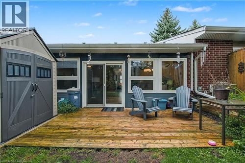 Rear view of property featuring a deck and a shed - 47 Bishop Reding Trail, Hamilton, ON - Outdoor With Exterior