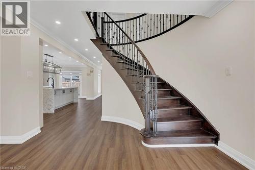 Stairway with wood finished floors, ornamental molding, and recessed lighting - 125 Valera Drive, Hamilton, ON 
