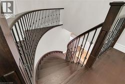 Stairway with wood finished floors and baseboards - 
