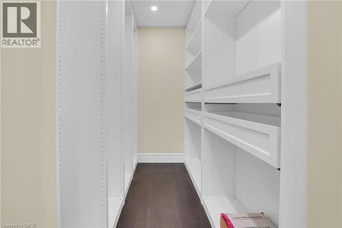 Spacious closet with dark wood-type flooring - 125 Valera Drive, Hamilton, ON 