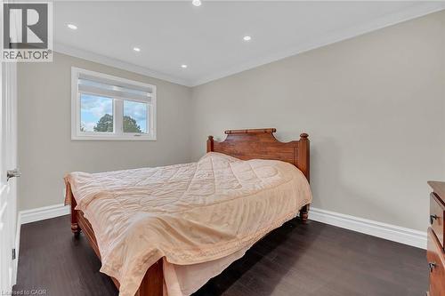 Bedroom with crown molding, dark wood-type flooring, and recessed lighting - 125 Valera Drive, Hamilton, ON 