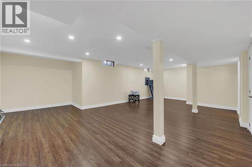 Finished below grade area with dark wood-style floors and recessed lighting - 125 Valera Drive, Hamilton, ON 