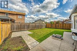 Fenced backyard with a patio and a residential view - 