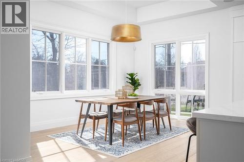 Dining room with healthy amount of natural light and light wood-style flooring - 1322 Minaki Road, Mississauga, ON - Indoor Photo Showing Dining Room