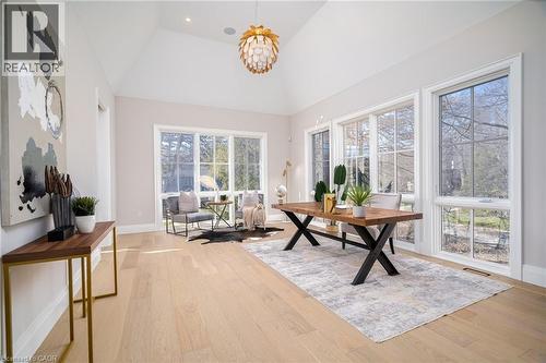 Office with light wood-style flooring, a chandelier, high vaulted ceiling, and recessed lighting - 1322 Minaki Road, Mississauga, ON - Indoor