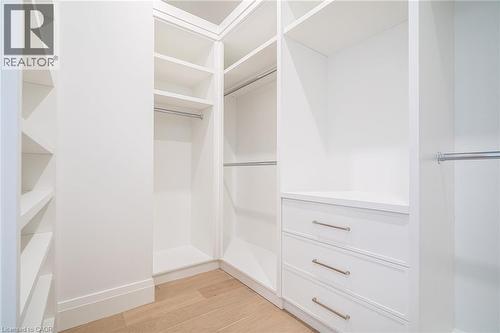 Spacious closet with light wood-style flooring - 1322 Minaki Road, Mississauga, ON - Indoor With Storage