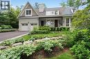 View of front facade with a standing seam roof, a metal roof, stone siding, and a porch - 1322 Minaki Road, Mississauga, ON  - Outdoor 