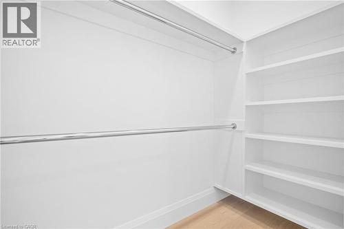 Walk in closet with light wood-style flooring - 1322 Minaki Road, Mississauga, ON - Indoor Photo Showing Other Room