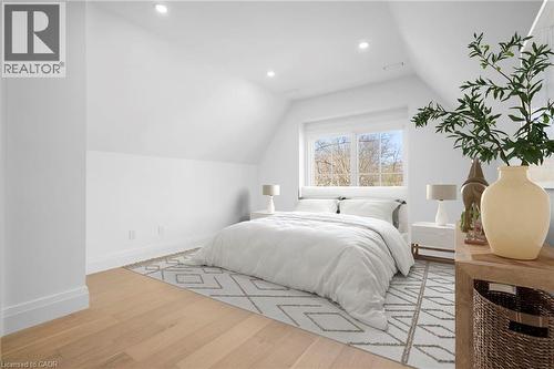 Bedroom with light wood-style flooring, vaulted ceiling, and recessed lighting - 1322 Minaki Road, Mississauga, ON - Indoor Photo Showing Bedroom
