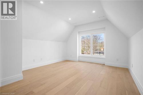 Bonus room featuring light wood-style floors, vaulted ceiling, and recessed lighting - 1322 Minaki Road, Mississauga, ON - Indoor Photo Showing Other Room