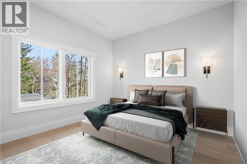 Bedroom with baseboards and light wood-style flooring - 1322 Minaki Road, Mississauga, ON - Indoor Photo Showing Bedroom