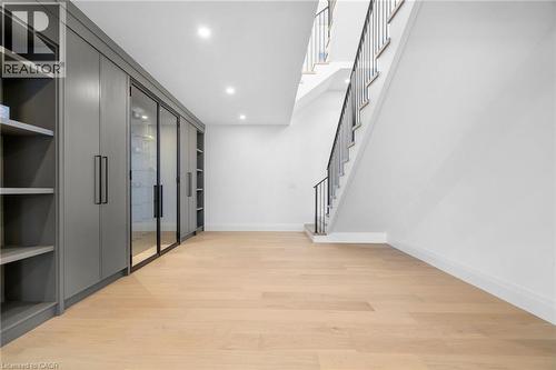 Hall with light wood-style floors, recessed lighting, and stairs - 1322 Minaki Road, Mississauga, ON - Indoor Photo Showing Other Room