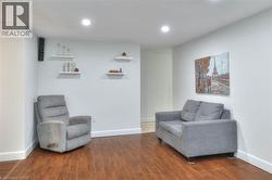 Living area featuring wood finished floors and recessed lighting - 