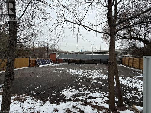Yard covered in snow featuring a fenced backyard - 43 Glen Road, Hamilton, ON 
