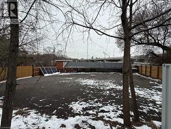 Yard covered in snow featuring a fenced backyard - 