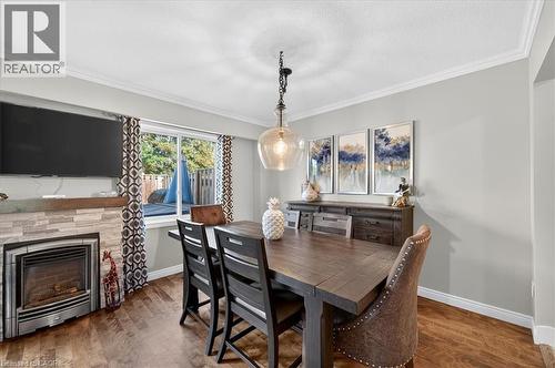 4198 Longmoor Drive Unit# 2, Burlington, ON - Indoor Photo Showing Dining Room With Fireplace