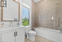 Full bath with a combined bath / shower with marble appearance and vanity - 