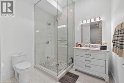 Full bath featuring vanity and a stall shower - 