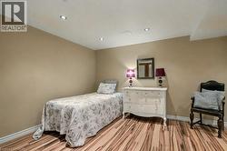 Bedroom featuring light wood-style flooring and recessed lighting - 
