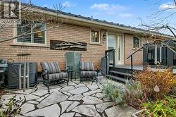 Rear view of property with a patio area and brick siding - 