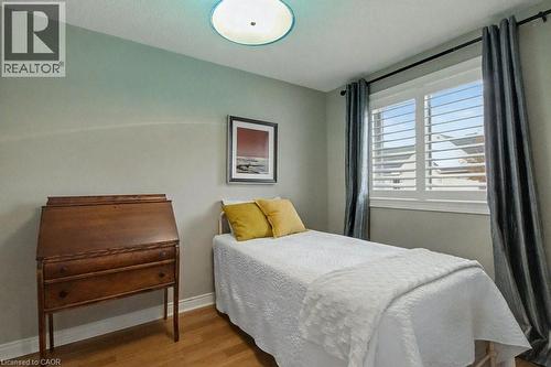 Bedroom featuring wood finished floors and baseboards - 165 Main Street E Unit# 9, Grimsby, ON - Indoor Photo Showing Bedroom