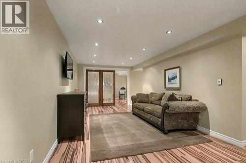 Living area featuring recessed lighting, light wood-style flooring, and french doors - 165 Main Street E Unit# 9, Grimsby, ON - Indoor