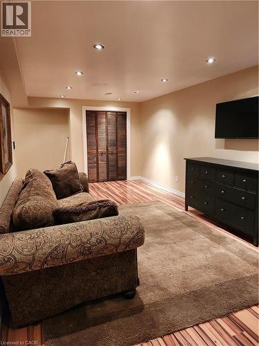 Living room featuring light wood-style floors and recessed lighting - 165 Main Street E Unit# 9, Grimsby, ON - Indoor Photo Showing Bedroom
