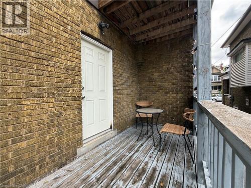 View of wooden terrace - 106 Spadina Avenue Unit# 1, Hamilton, ON - Outdoor With Exterior