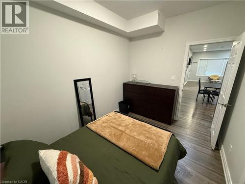 Bedroom featuring wood finished floors and baseboards - 106 Spadina Avenue Unit# 1, Hamilton, ON - Indoor