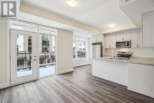 1593 Rose Way Unit# 105, Milton, ON - Indoor Photo Showing Kitchen With Upgraded Kitchen