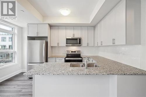 1593 Rose Way Unit# 105, Milton, ON - Indoor Photo Showing Kitchen With Upgraded Kitchen