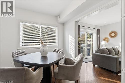 Dining area with dark wood-style flooring - 2069 Meadowbrook Road Unit# 4, Burlington, ON - Indoor