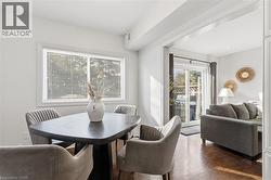 Dining area with dark wood-style flooring - 