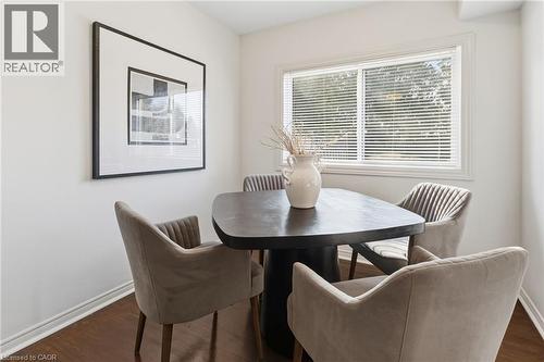 Dining space featuring baseboards and dark wood finished floors - 2069 Meadowbrook Road Unit# 4, Burlington, ON - Indoor Photo Showing Dining Room