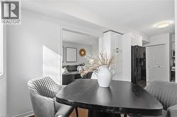 Dining room featuring light wood-type flooring and baseboards - 