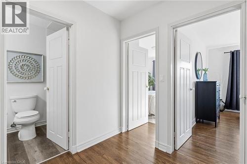 Corridor with dark wood finished floors and baseboards - 2069 Meadowbrook Road Unit# 4, Burlington, ON - Indoor