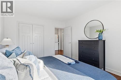 Bedroom featuring a closet and wood finished floors - 2069 Meadowbrook Road Unit# 4, Burlington, ON - Indoor Photo Showing Bedroom