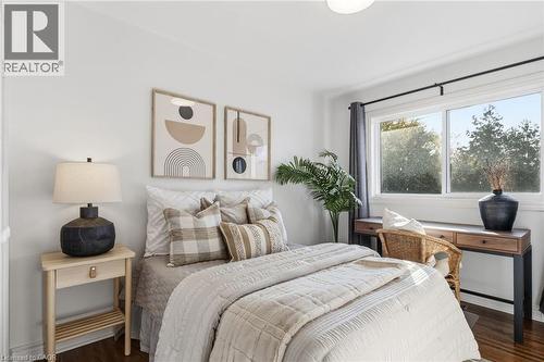 Bedroom with dark wood-style flooring and baseboards - 2069 Meadowbrook Road Unit# 4, Burlington, ON - Indoor Photo Showing Bedroom