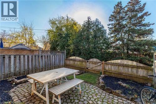 Fenced backyard featuring a patio and outdoor dining area - 2069 Meadowbrook Road Unit# 4, Burlington, ON - Outdoor