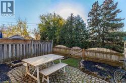 Fenced backyard featuring a patio and outdoor dining area - 
