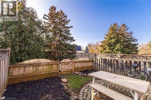 Fenced backyard with outdoor dining space and a gate - 2069 Meadowbrook Road Unit# 4, Burlington, ON - Outdoor