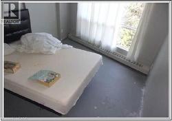 Bedroom featuring baseboard heating - 