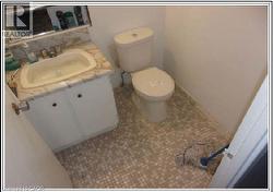 Bathroom with vanity and tile patterned flooring - 