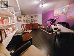 Warm, comfortable basement office with built-in bookshelves. - 