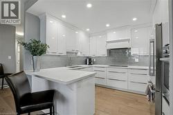 Bright, White Kitchen offers plenty of storage- cabinets & drawers - 