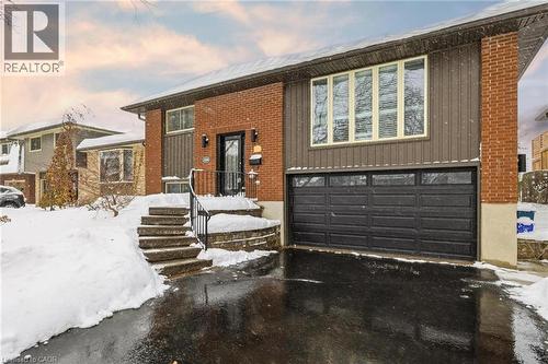 View of front of house with a garage, driveway, and brick siding - 364 Roselawn Place, Waterloo, ON - Outdoor